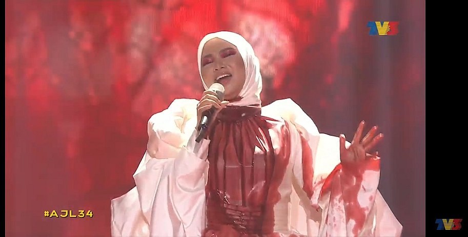 Malaysian Singer Aina Abdul Claims Misunderstanding After Coming Under Fire For Suicidal Performance At Ajl 34 Nestia