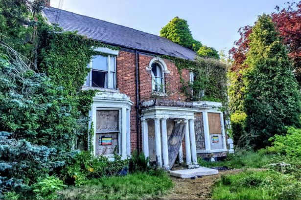 Inside abandoned house caked in dirt and rubble that