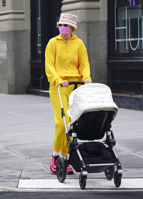 Gigi Hadid Shows Off Her Casual Mom Style with a Yellow Tracksuit and Prada  Bucket Hat | Nestia